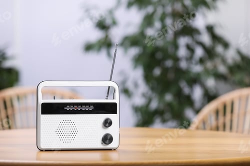 Preview: Stylish radio receiver on wooden table indoors, space for text