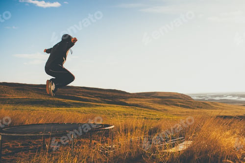 Preview: Man on trampoline in Iceland.