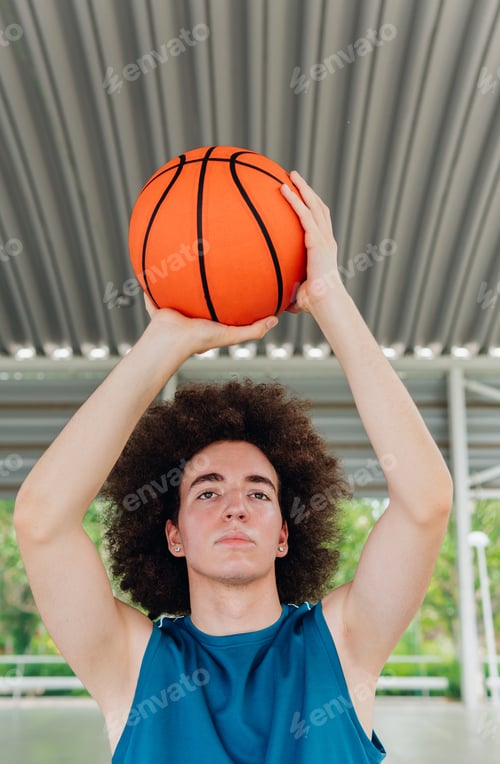 Preview: Teenage boy ready to throw a basketball