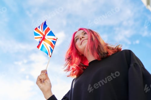 Preview: Female student teenager with British flag, blue sky with clouds background