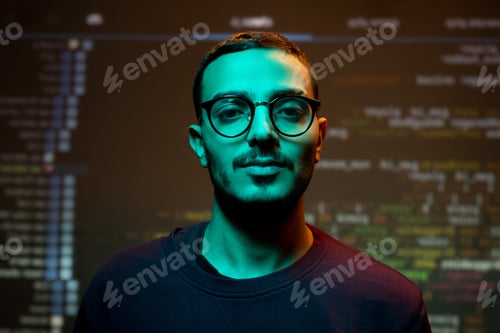 Preview: Young Arabian programmer against coding background