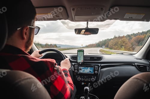 Preview: road trip concept man driving car by highway inside view
