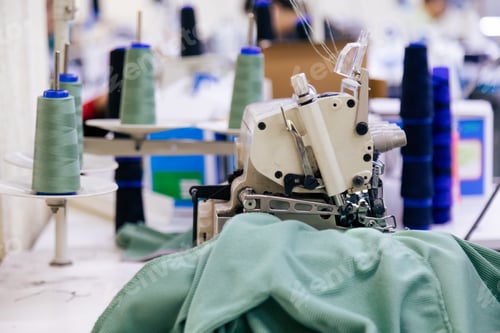 Preview: Tailor working on electric sewing machine