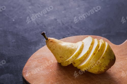 Preview: Healthy food, fruit background, sliced pear