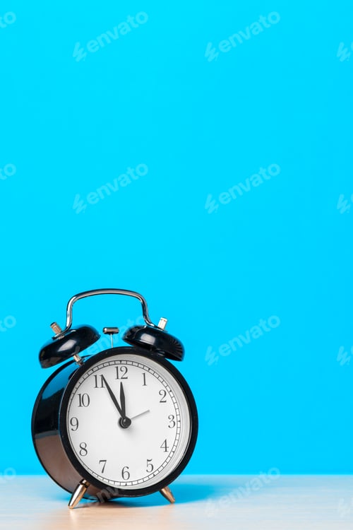 Preview: retro alarm clock on table. creative photo.