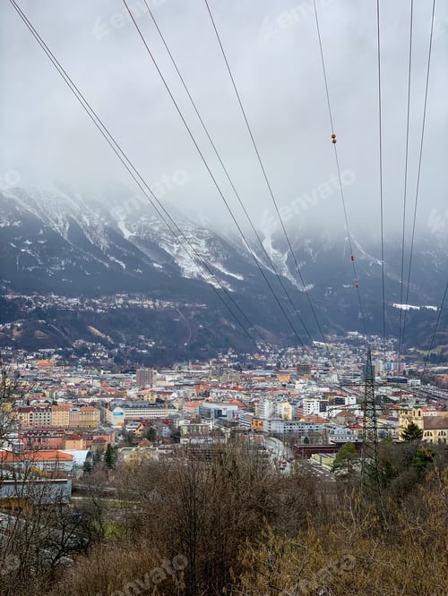 Preview: View on a colorful beautiful old European houses in Innsbruck. Mountains view. Mountains and forest.