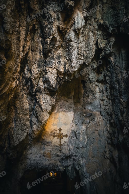 Preview: crucifix hanging in a shrine in a cave