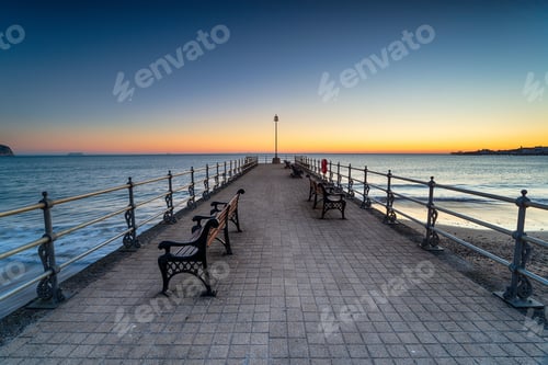 Preview: Sunrise over the Banjo Pier on the beach at Swanage