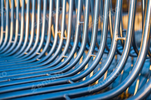 Preview: Close-up street bench metal pipes arranged parallel