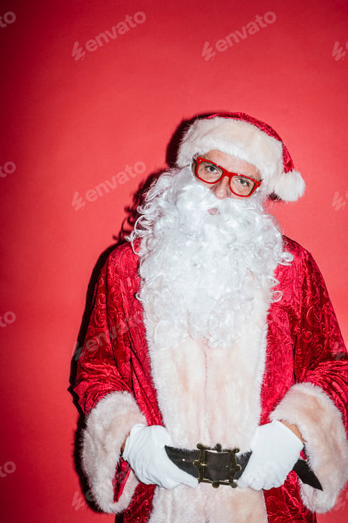 Preview: Man dressed as Santa Claus gesturing with funny glasses