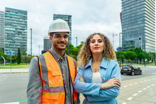 Preview: Confident architects and engineers standing in urban city