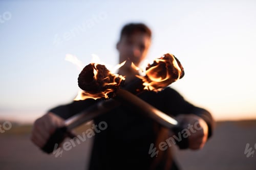 Preview: Fire Show Performer Crossing Flaming Rods