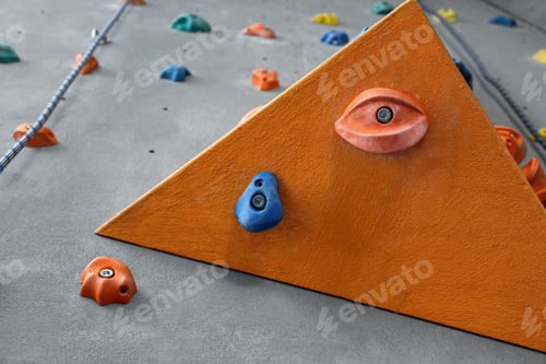 Preview: Climbing wall with holds in gym. Extreme sport