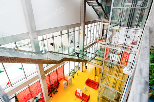 Preview: High-angle view of interior of a modern spacious library with computers for public