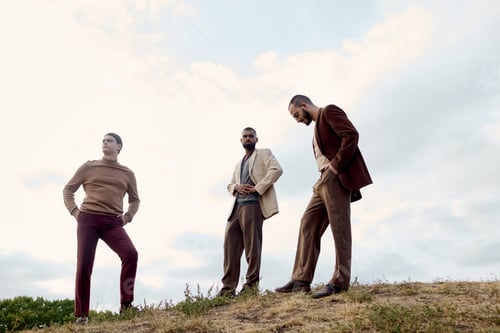 Preview: Men in style savoring an autumn day in a vibrant, picturesque field
