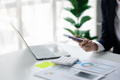 Preview: Work with Laptop and Financial Charts on Desk