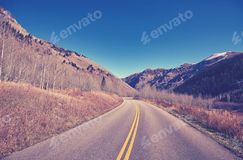 Preview: Vintage color toned scenic mountain road.