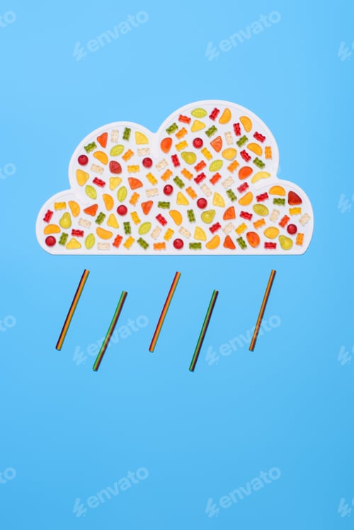 Preview: top view of rainy cloud made of gummy candies isolated on blue