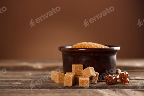 Preview: Brown sugar cubes with a ceramic bowl