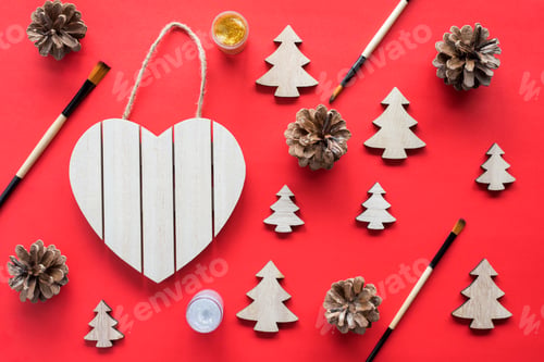 Preview: Christmas tree craft wooden eco friendly natural holiday concept on red background.
