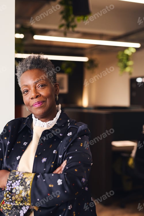 Preview: Confident Woman in an Office with Arms Crossed