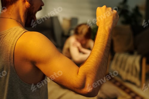 Preview: Man Raising Fist Toward Crying Woman during Argument