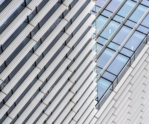 Preview: Modern skyscraper with many windows during daytime