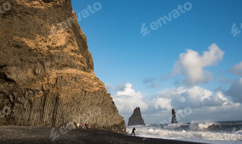 Preview: People sightseeing at reynisfjara black sand beach in ViK south Iceland. Atlantic ocean