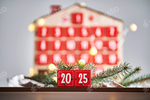 Preview: Christmas Advent calendar in the shape of a house with boxes making up the number 2025.