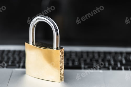 Preview: selective focus of metal padlock on digital device in office