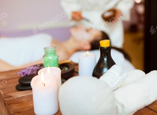 Preview: Young woman in a mask for the face of the therapeutic white mud. Spa treatment