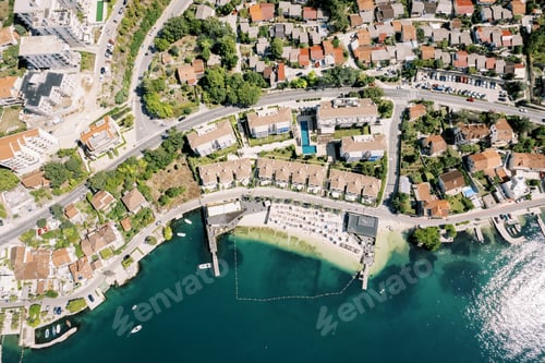 Preview: Brown roofs of the Huma Kotor Bay Hotel with a private beach. Dobrota, Montenegro. Drone