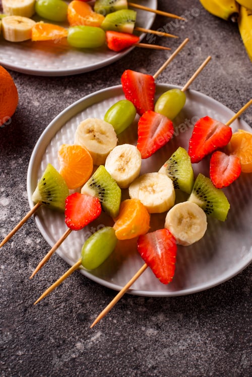 Preview: Colorful Fresh Fruit Skewers on Plates