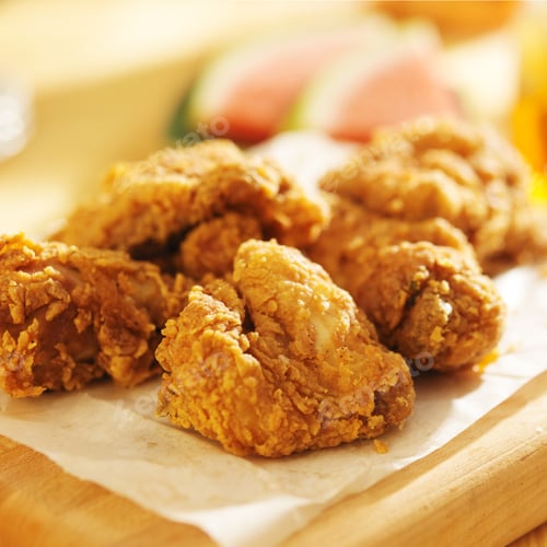 Preview: pile of fried chicken with watermelon in background