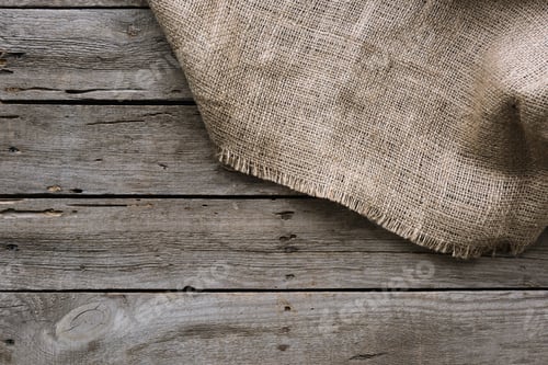 Preview: full frame of sack clothes on wooden surface