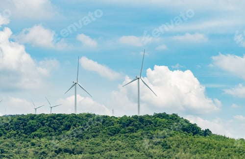 Preview: Wind Turbines on Lush Green Hill Under Blue Sky