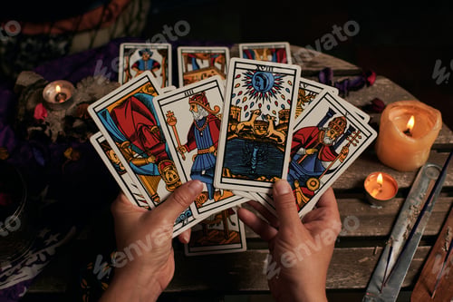 Preview: Close-up of a fortune teller reading tarot cards