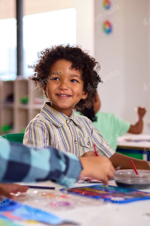 Preview: Classroom Portrait Of Smiling Male Elementary School Pupil In Art Class At School