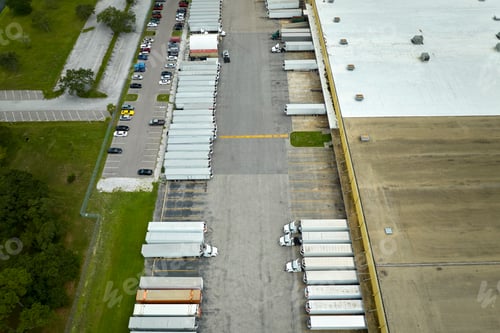 Preview: Aerial view of large commercial distribution center with many trucks