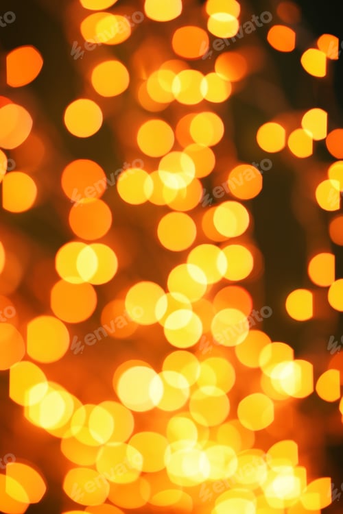 Preview: Beautiful gold lights on dark background. Bokeh effect