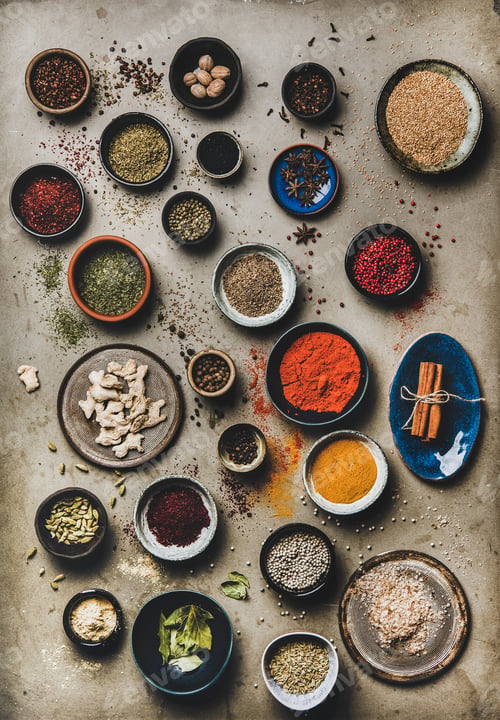 Preview: Flat-lay of colorful spices in bowls over grey concrete background
