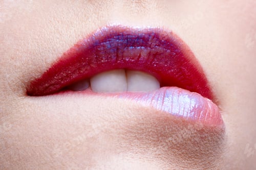 Preview: Close Up Portrait Of European Girl Biting Her Lips