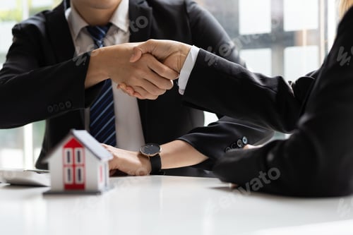 Preview: Handshake after reaching a real estate deal. Signing a house rental, mortgage, lease agreement.