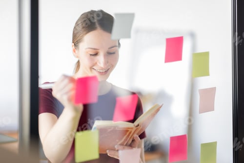 Preview: Business woman meeting at office and use post it notes in glass wall to share idea. Brainstorming bu