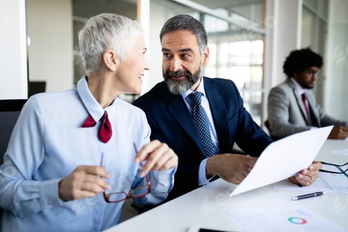 Preview: Business people working discussing as a team at the office