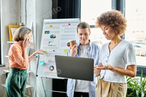 Preview: Collaborative Innovation: Diverse Team Engaged With Laptop