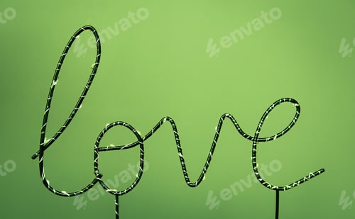 Preview: Close-up, the word love on a colored background.