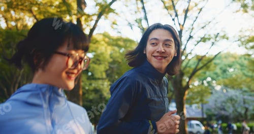 Vista previa: Running, love or happy couple in park for fitness, wellness or health with smile or energy in Japan