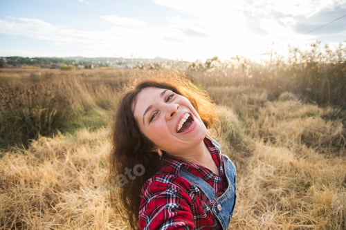 Preview: Travel, vacation and holiday concept - Happy young woman having fun taking selfie against background