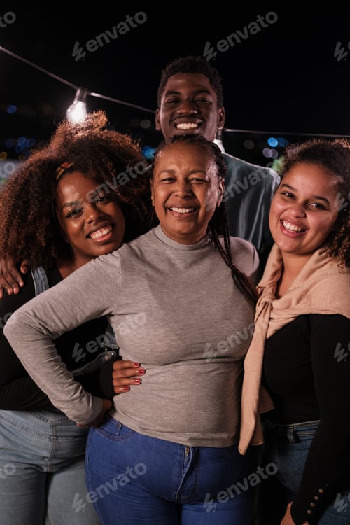 Preview: Smiling family at a terrace party having a celebration. Concept: together, fun, bond